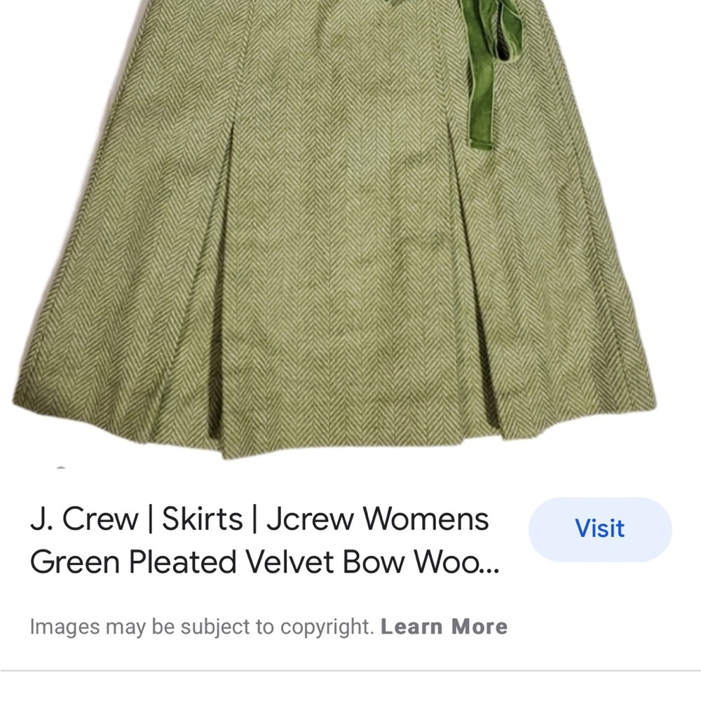 Woman’s JCrew green wool pleated skirt with velvet bow.